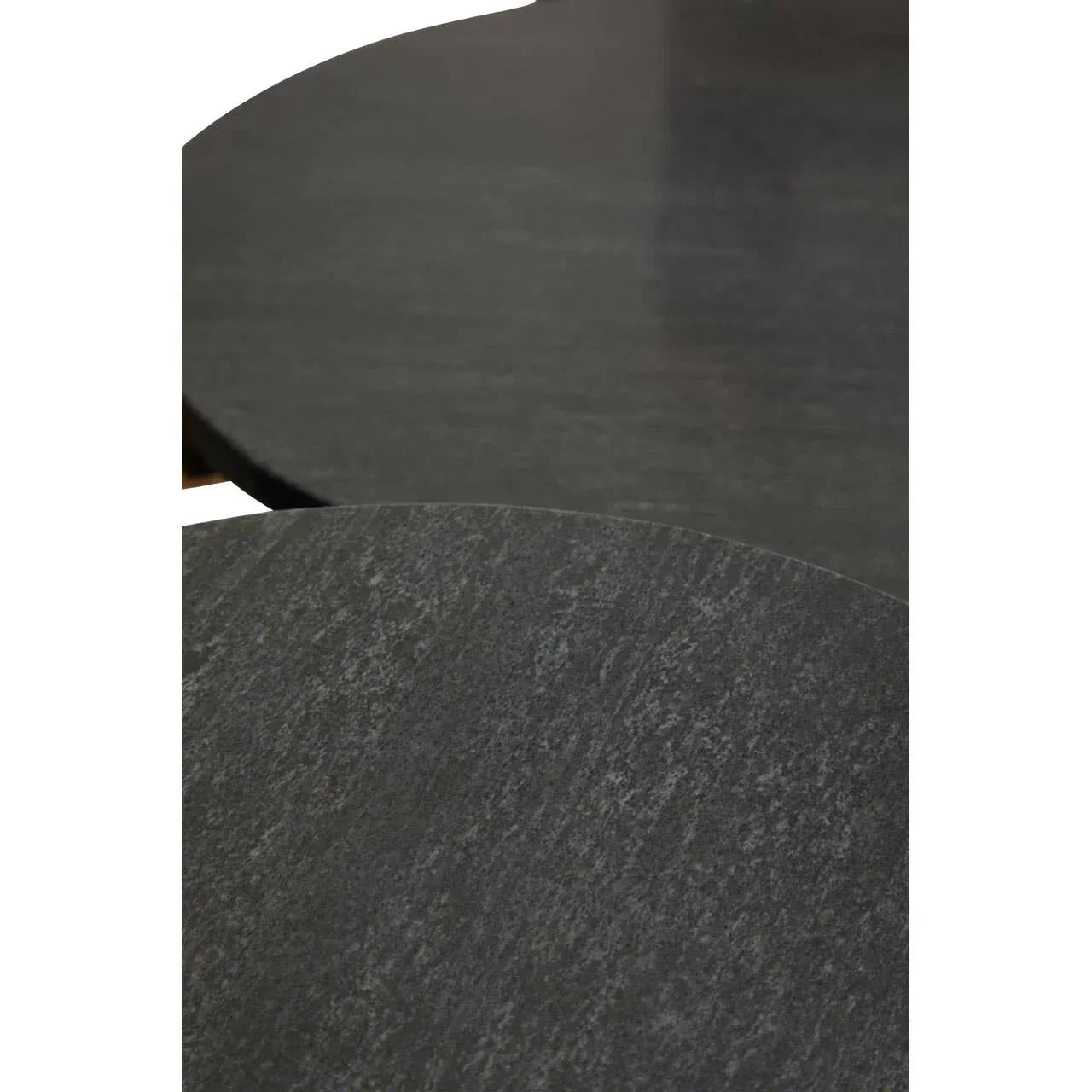 Black stone nesting coffee tables with textured finish, close-up of round tabletops
