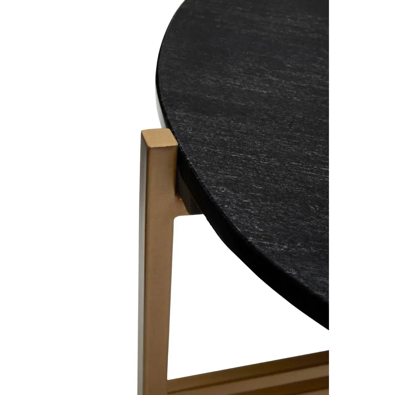 Closeup of black marble table top with gold metal frame