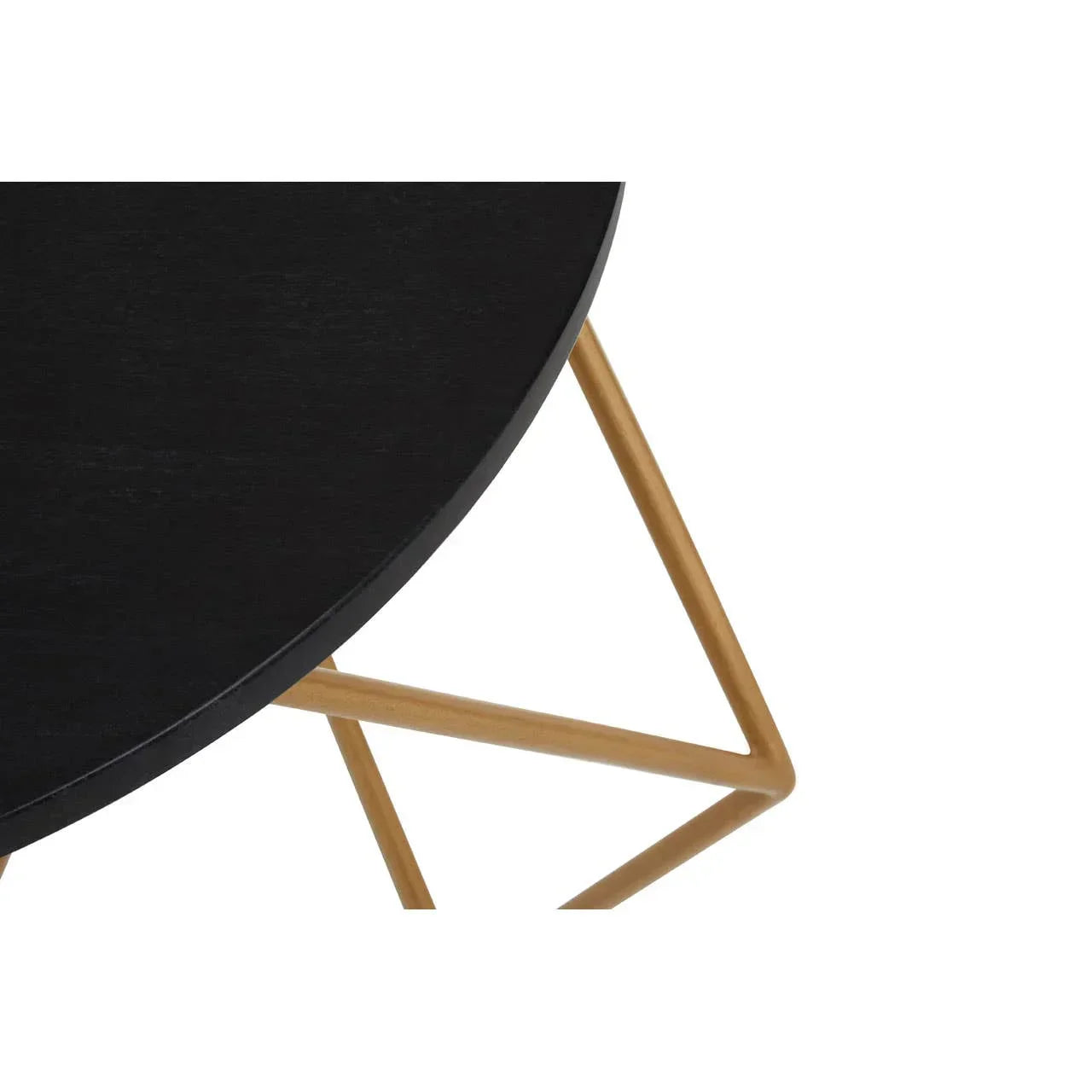 Black round coffee table with gold geometric metal legs, close-up view