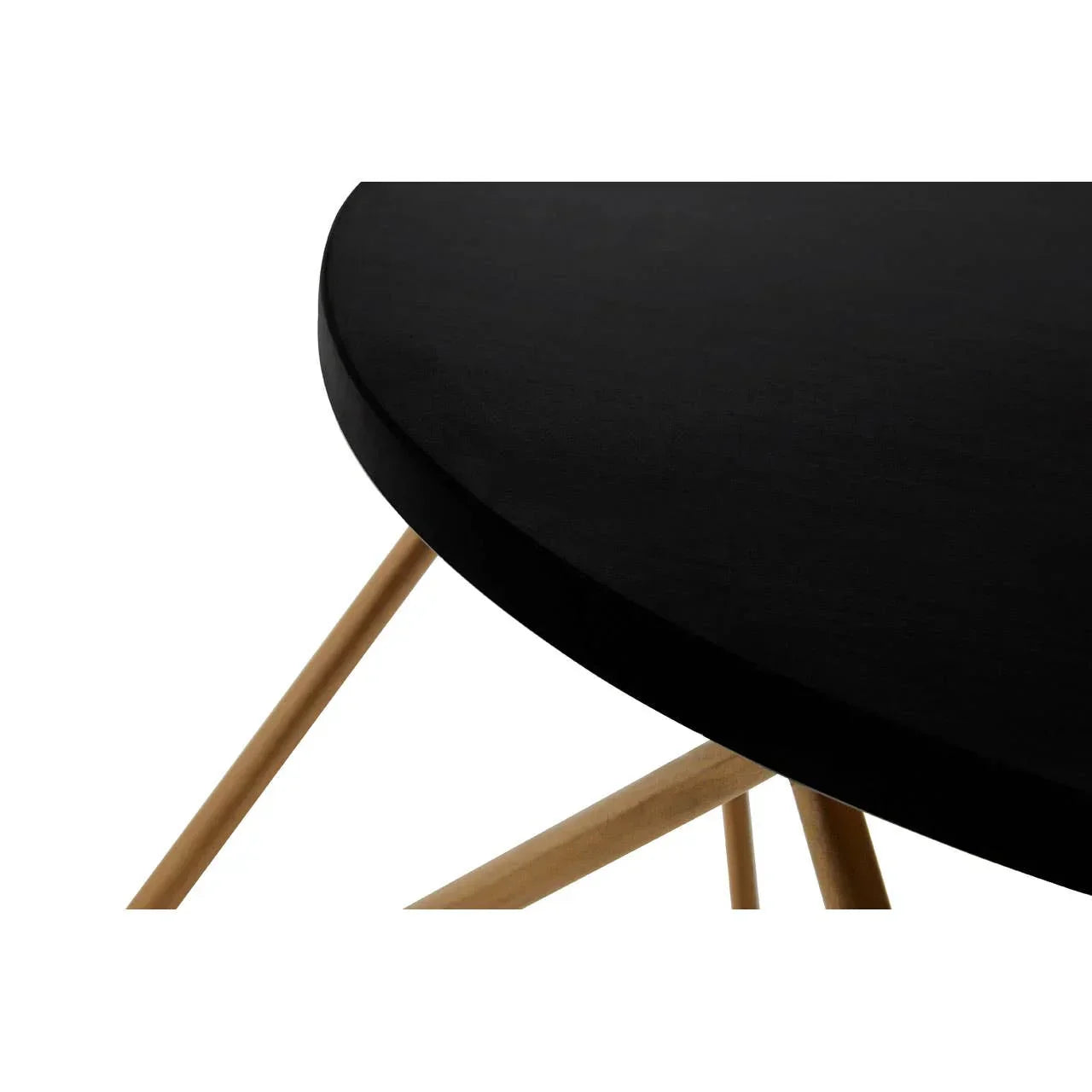Round black dining table with wooden legs, close-up of tabletop and frame detail