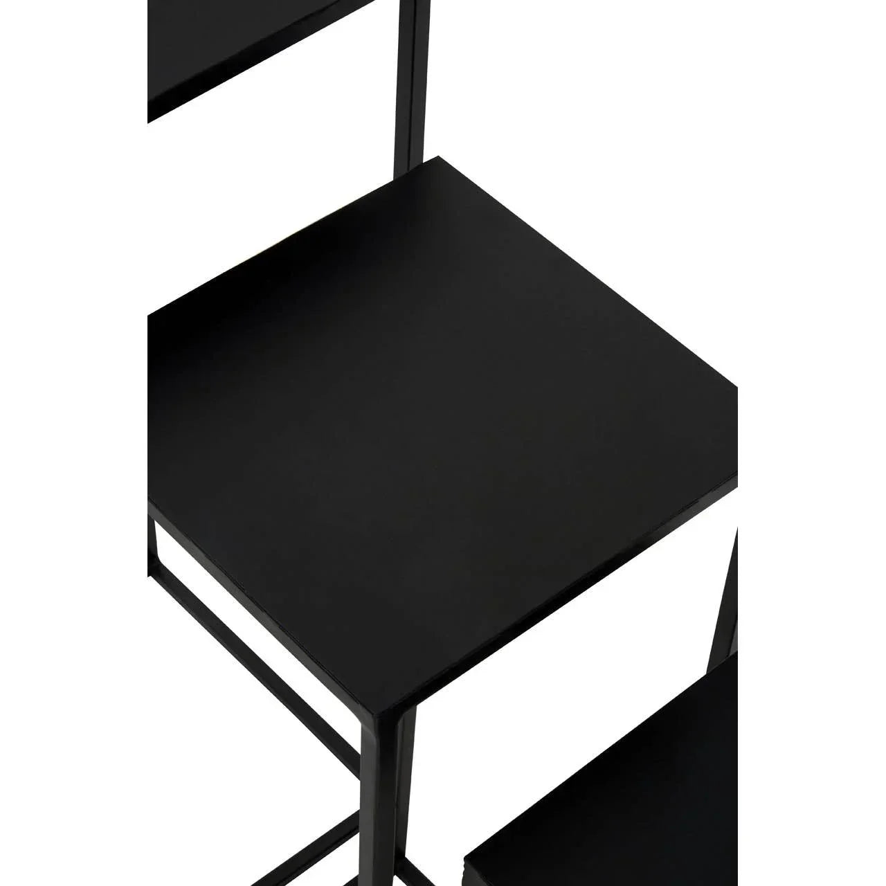 Black metal nesting table set with square tops and minimalist frame, close-up view