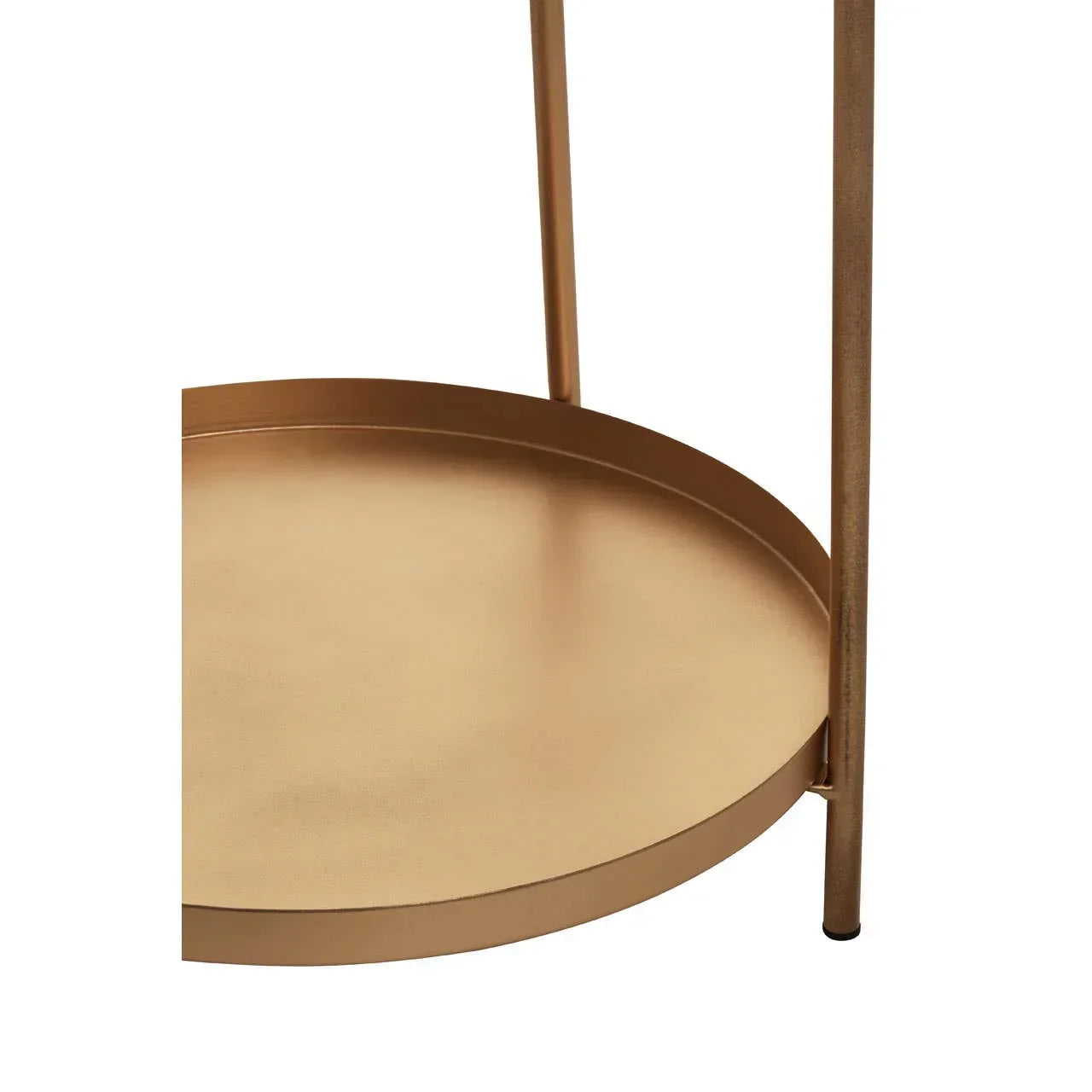 Gold metal side table with round shelf and minimalist frame, close-up view