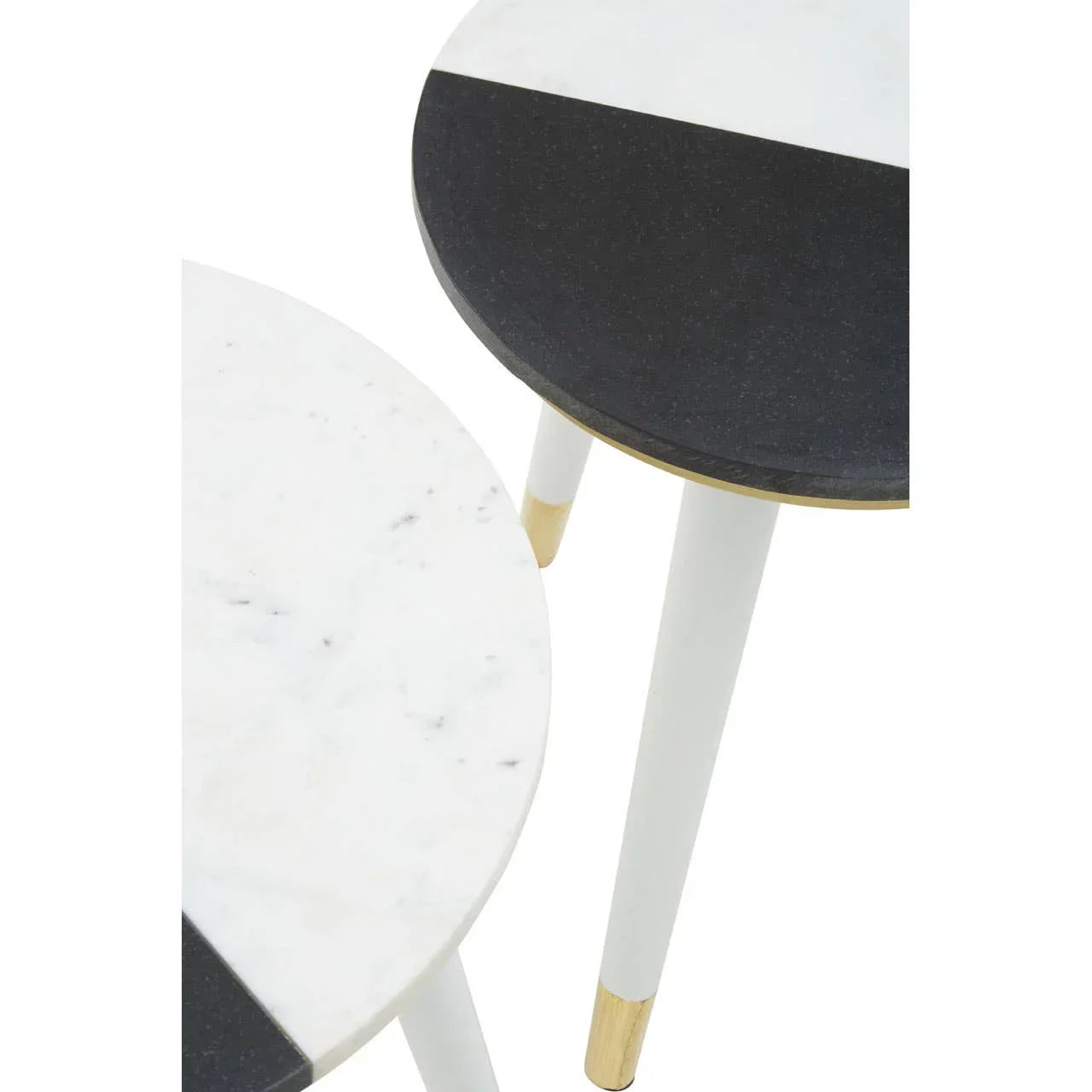 Set of two round marble side tables with black and white tops and gold leg accents
