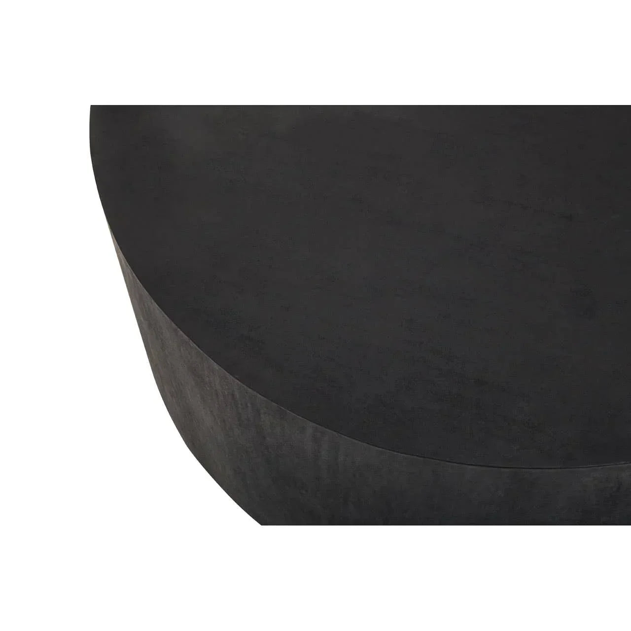 Closeup of black round coffee table with smooth matte surface