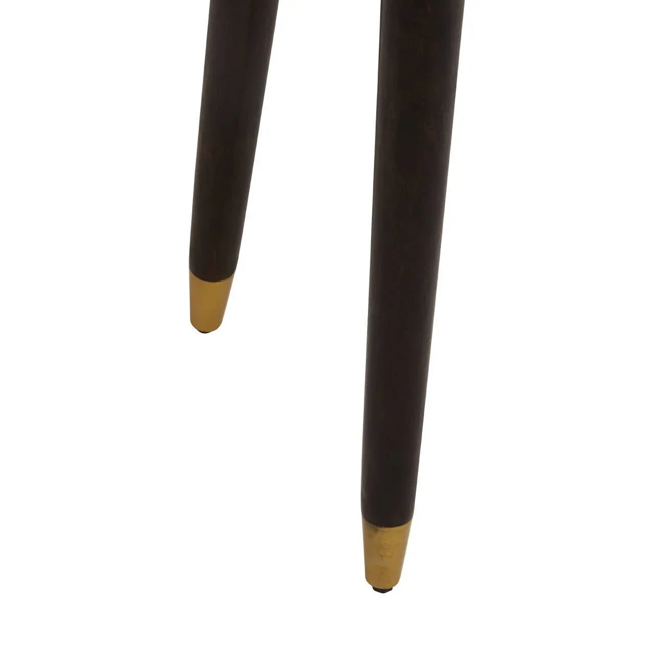 Close view of wooden furniture legs with gold metal tips