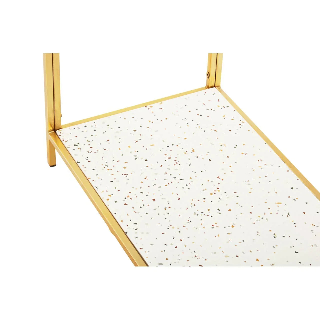 Close view of terrazzo table top with gold metal frame and speckled surface design