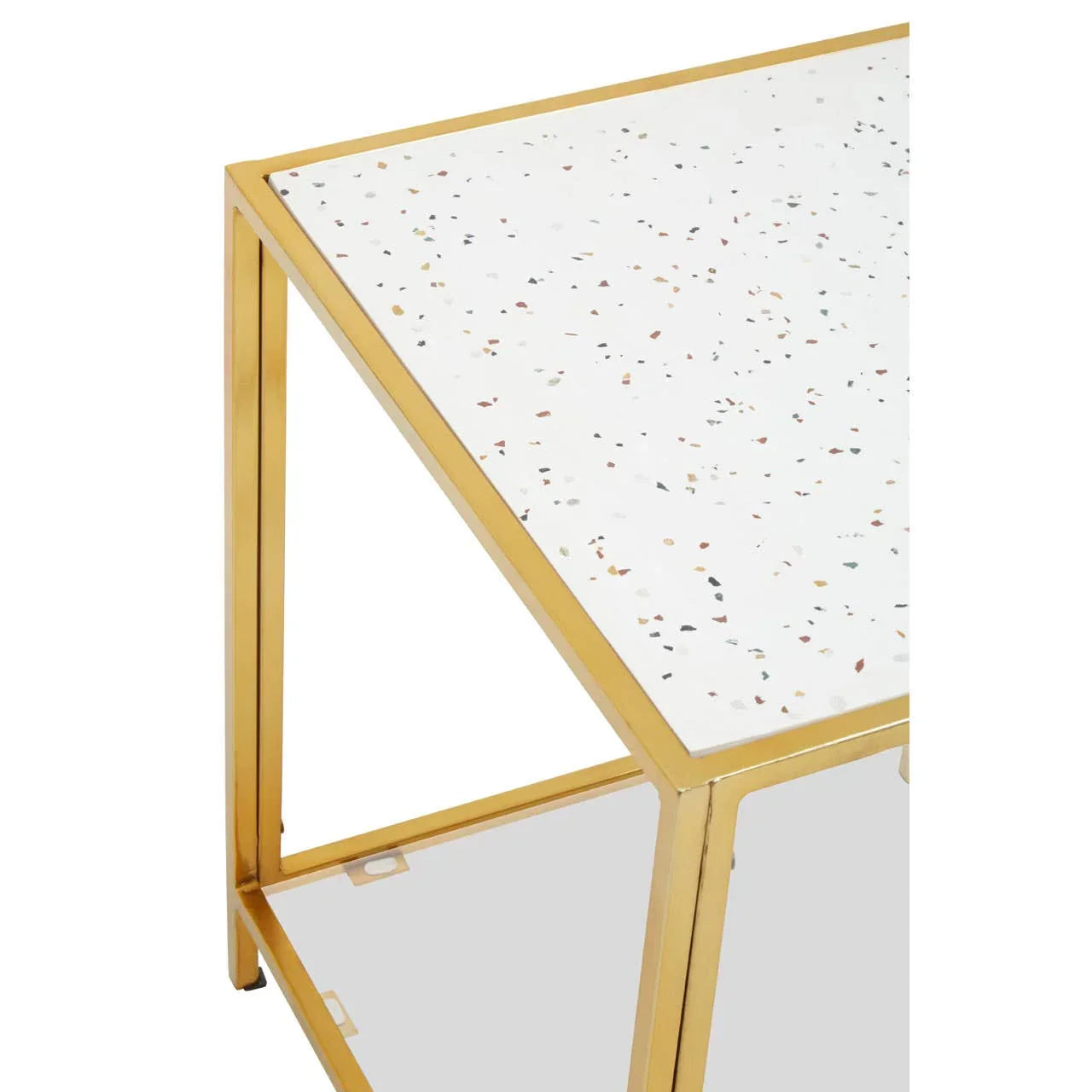 Terrazzo side table with gold metal frame and white speckled top, corner detail view