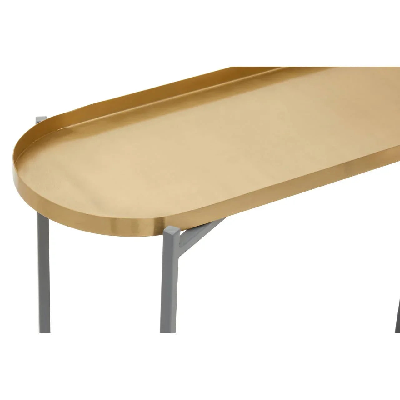 Gold metal console table top with raised edge and slim silver legs, close-up view
