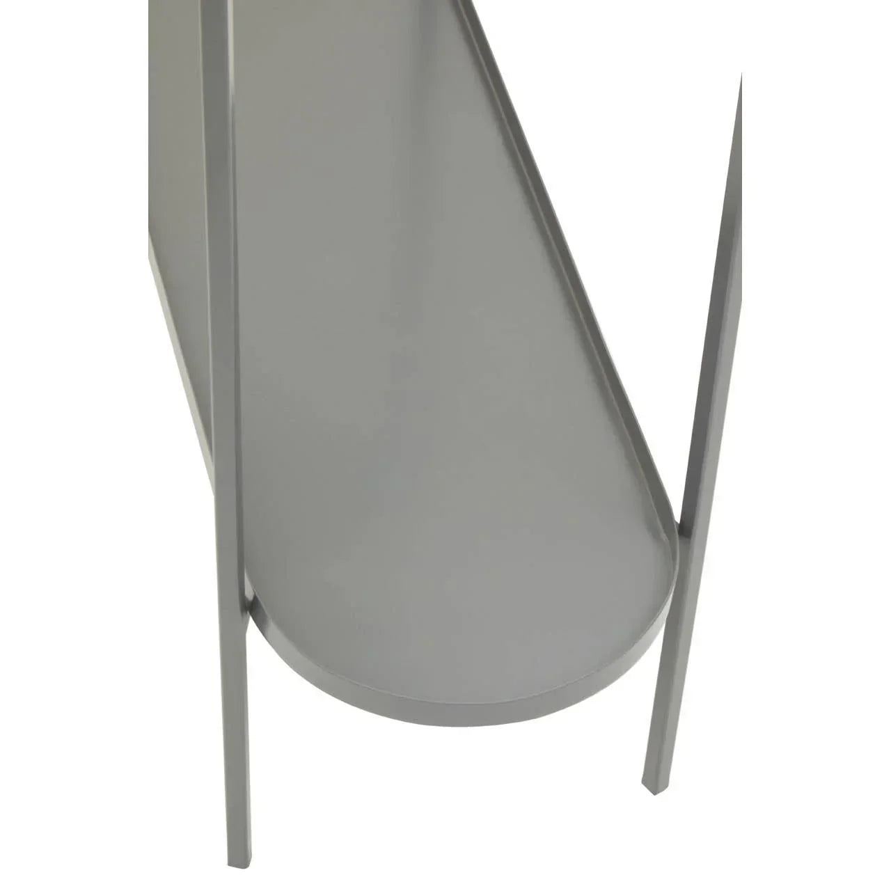 Grey metal shelf detail with curved edge on modern furniture unit