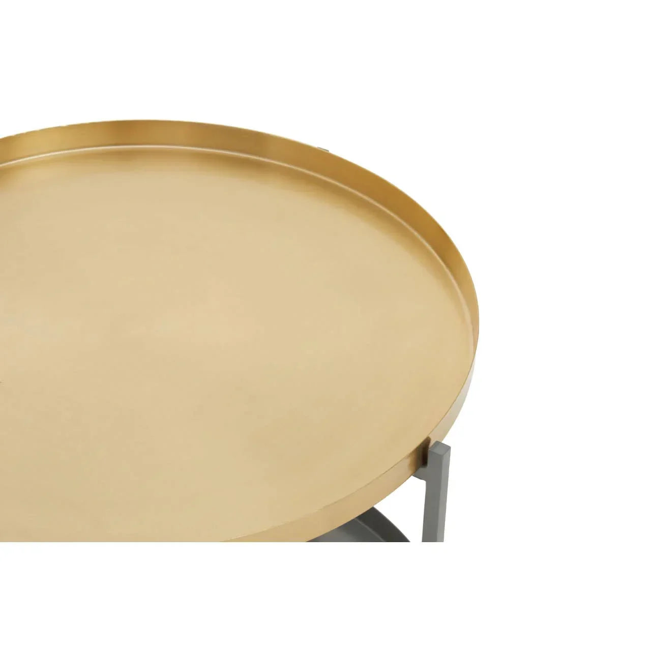 Round gold metal tray table top with raised edge, partial view on light background
