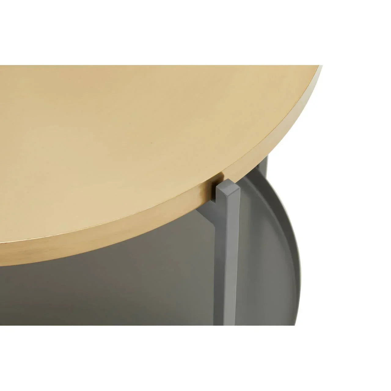 Round gold metal side table with grey metal legs, close-up of top and frame