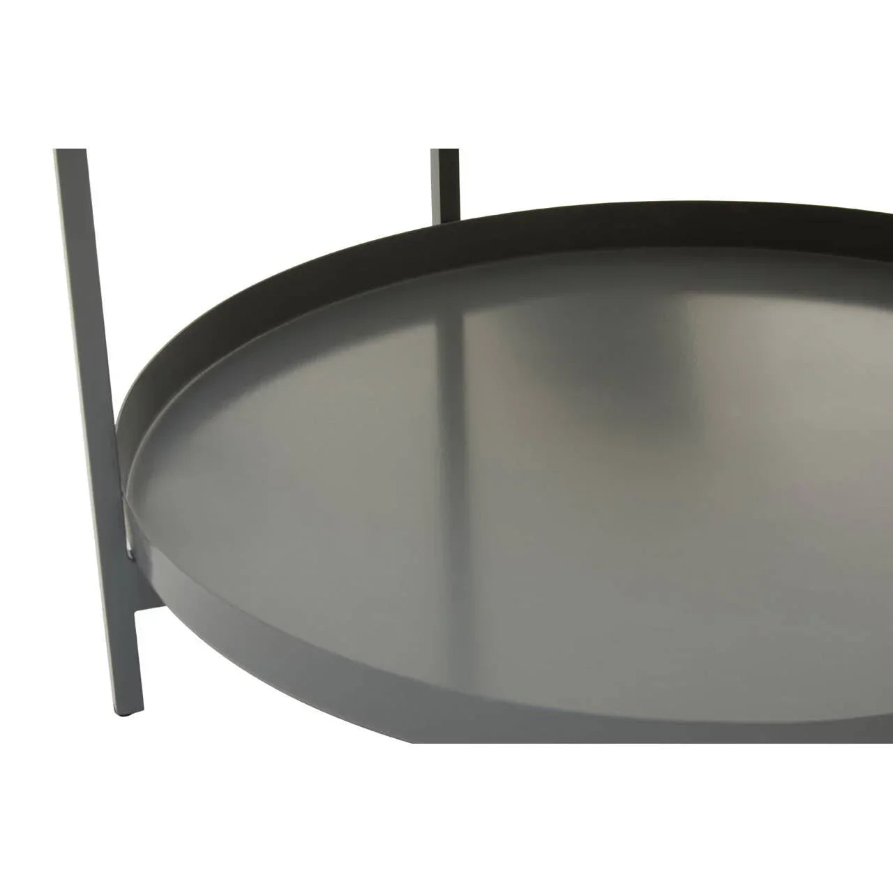 Closeup of round grey metal side table lower shelf with raised edge