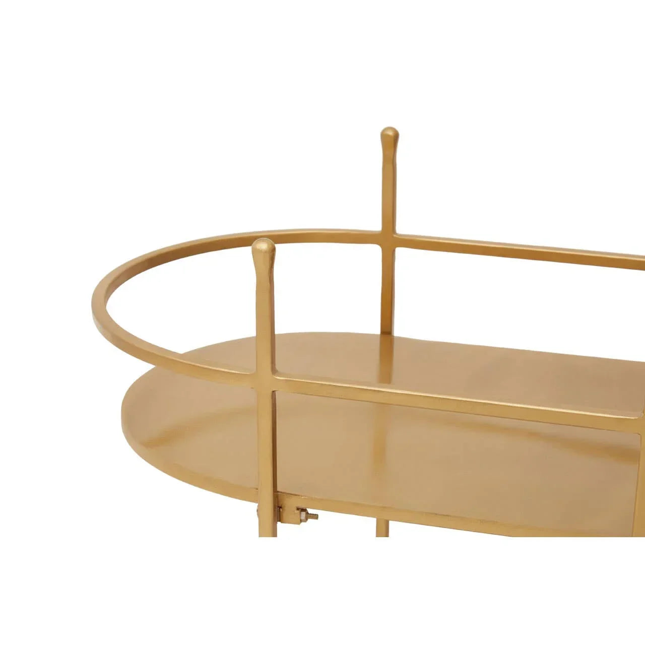 Close view of gold metal bar cart shelf with rounded rail detail