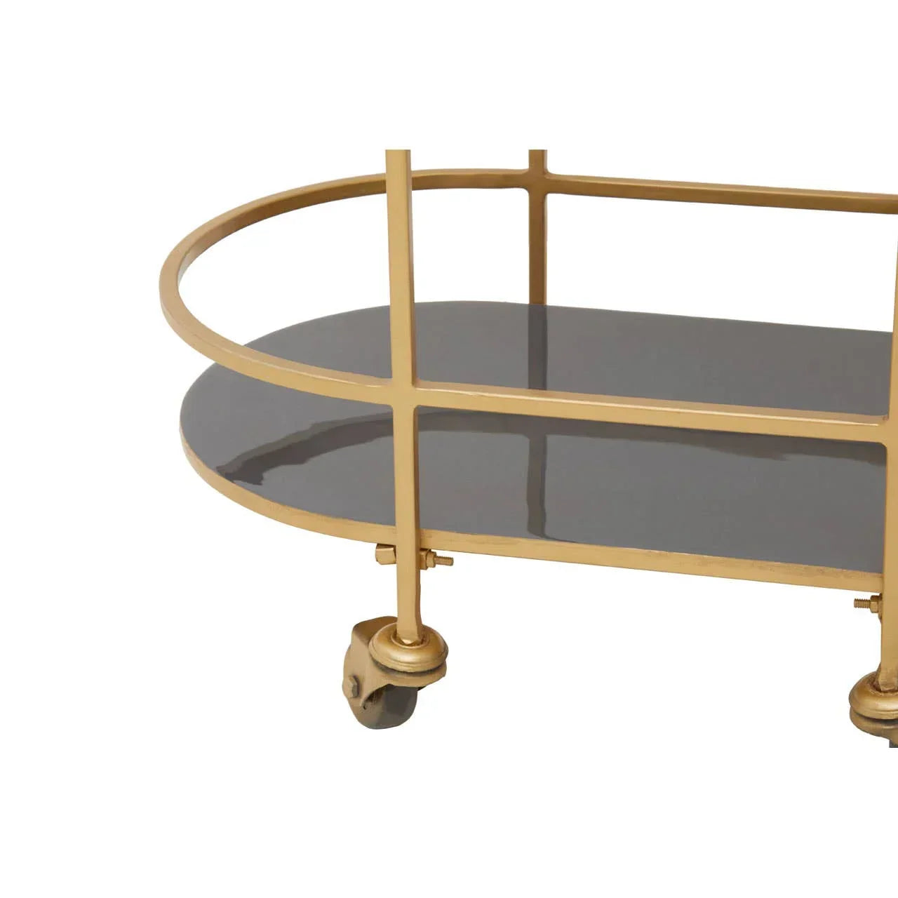 Gold frame drinks trolley with black glass shelf and swivel caster wheels, close-up view
