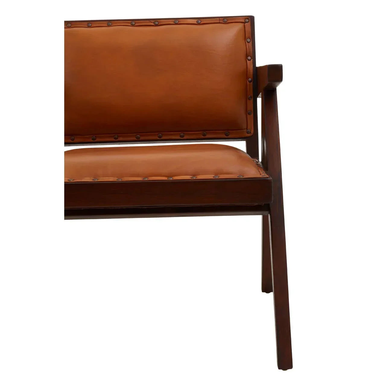 Closeup of brown leather dining chair with wooden frame and studded trim detail