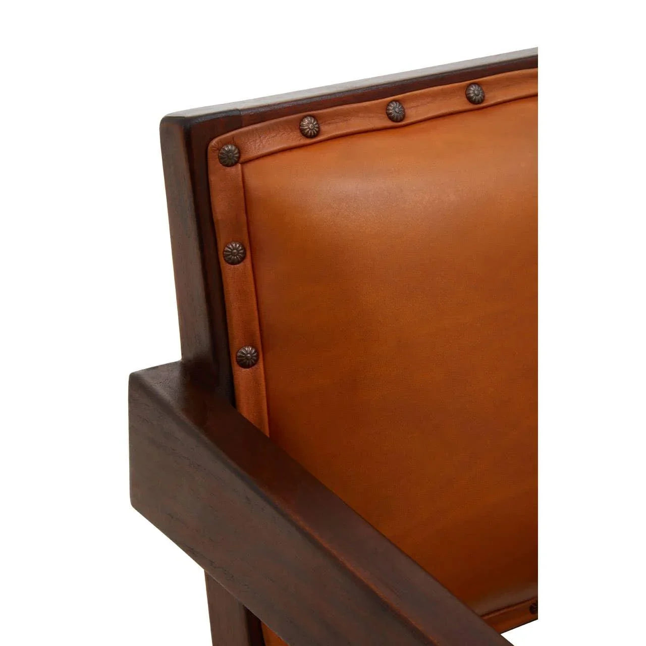 Closeup of brown leather chair back with stud detailing and dark wood frame