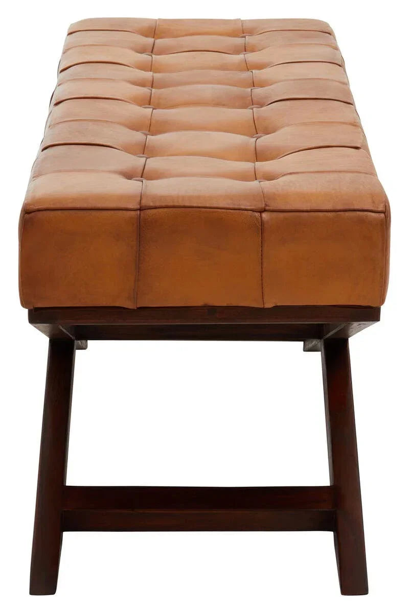 Tan leather bench with tufted seat and dark wood legs, front view