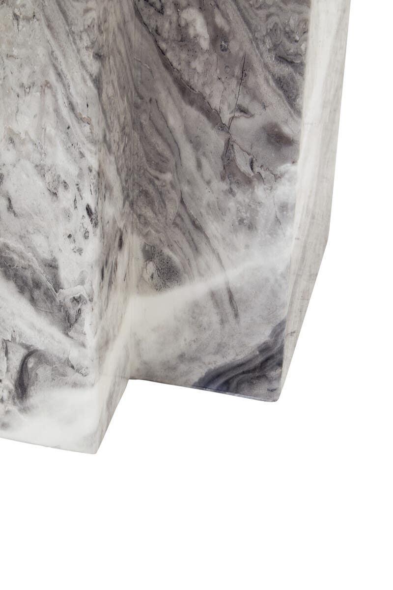 Close-up of grey marble table corner showing unique natural veining and texture