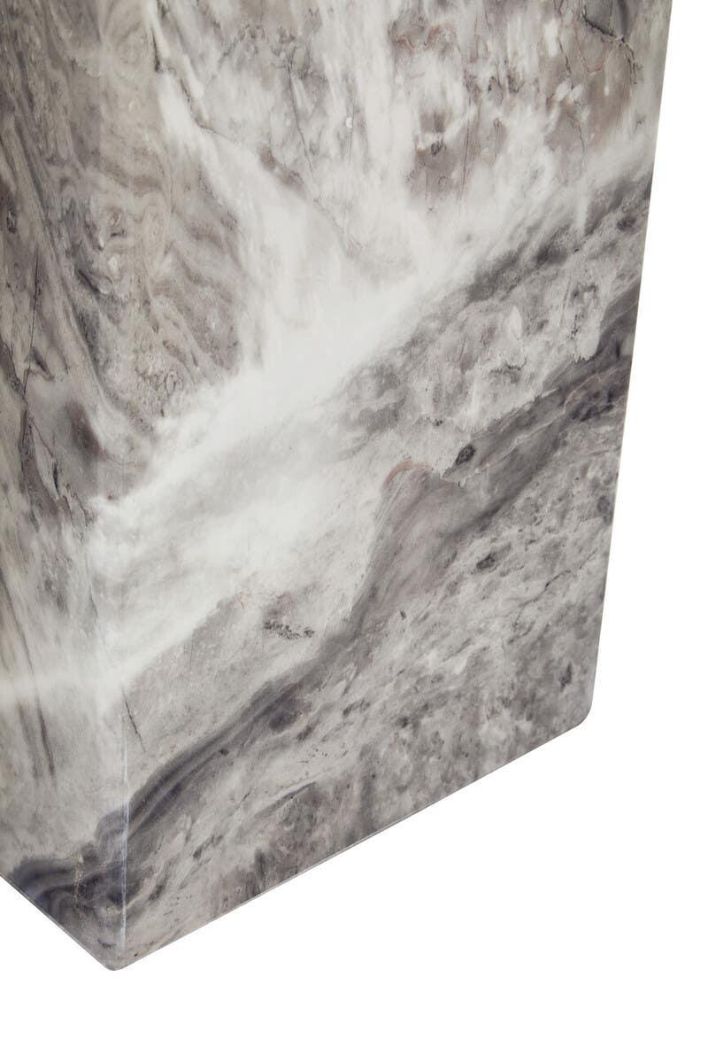 Closeup of grey marble table corner with natural veined stone pattern