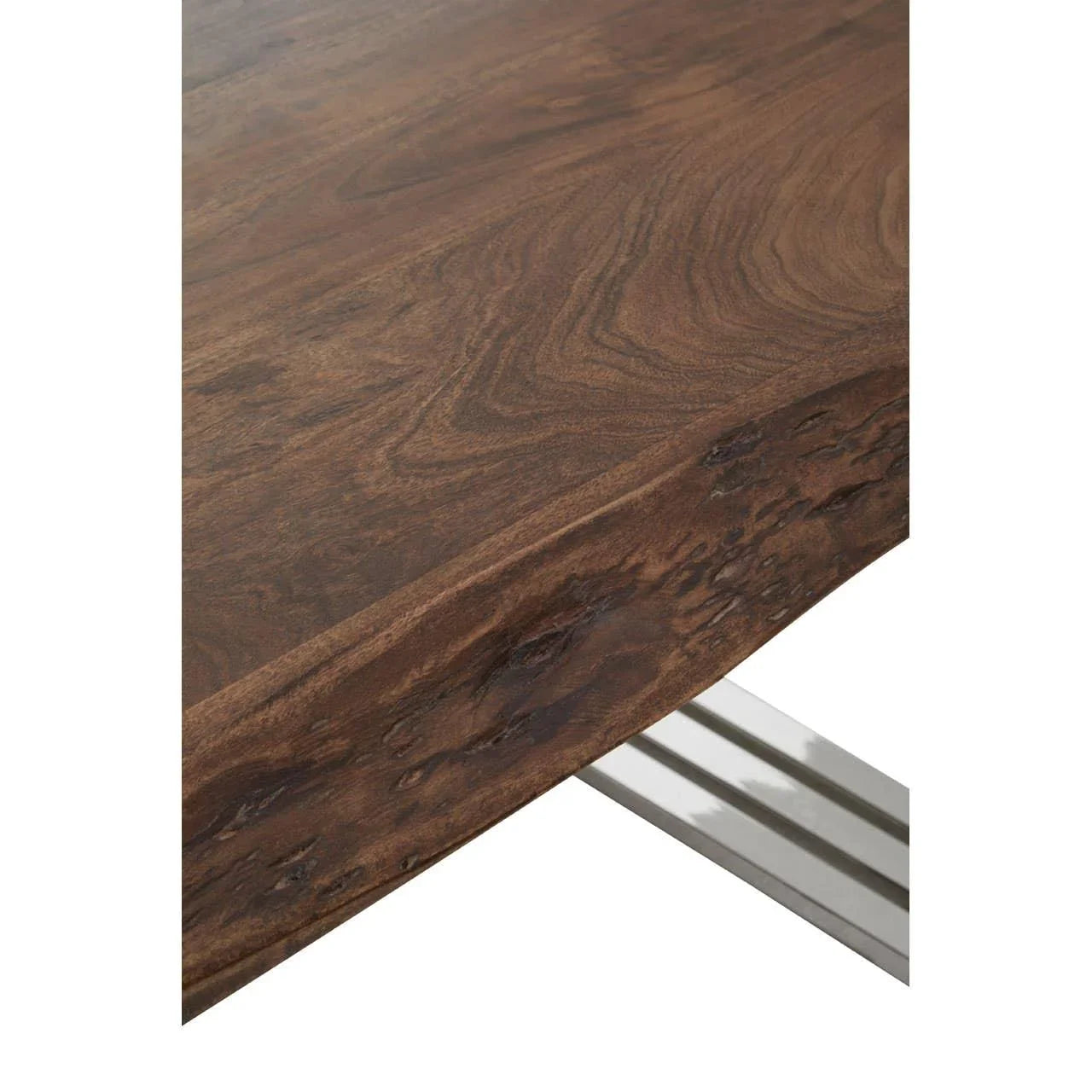 Closeup of live edge wooden dining table with natural grain and metal legs