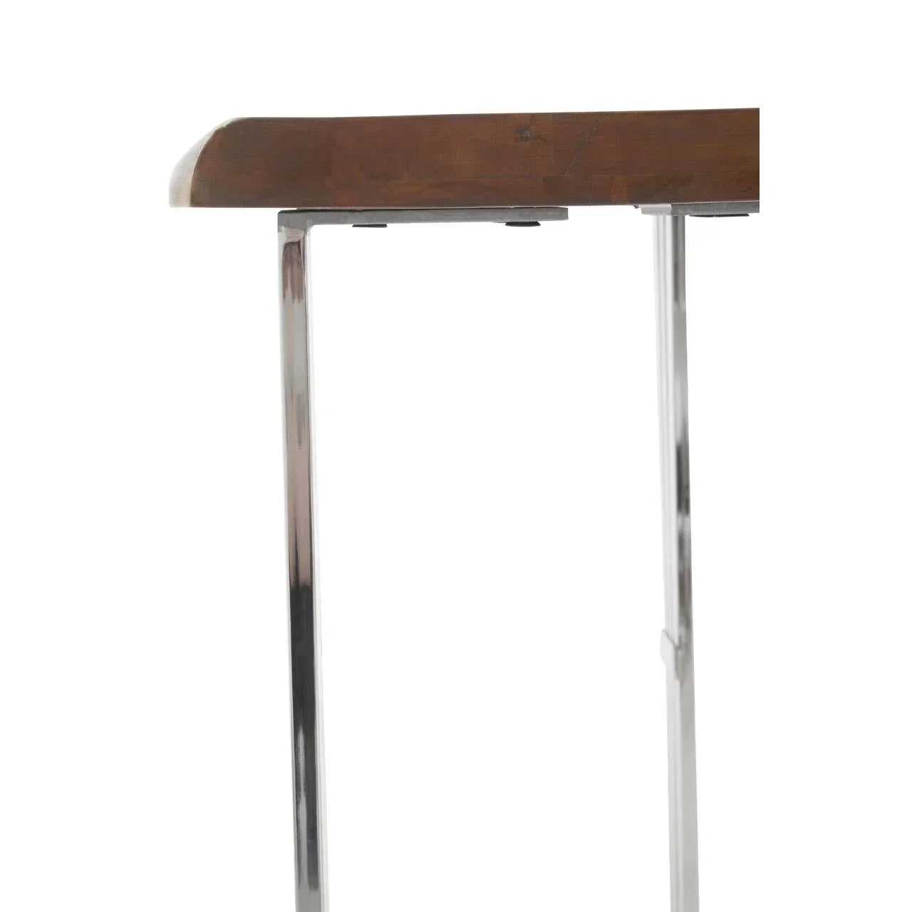 Side view of wooden table top with chrome metal legs