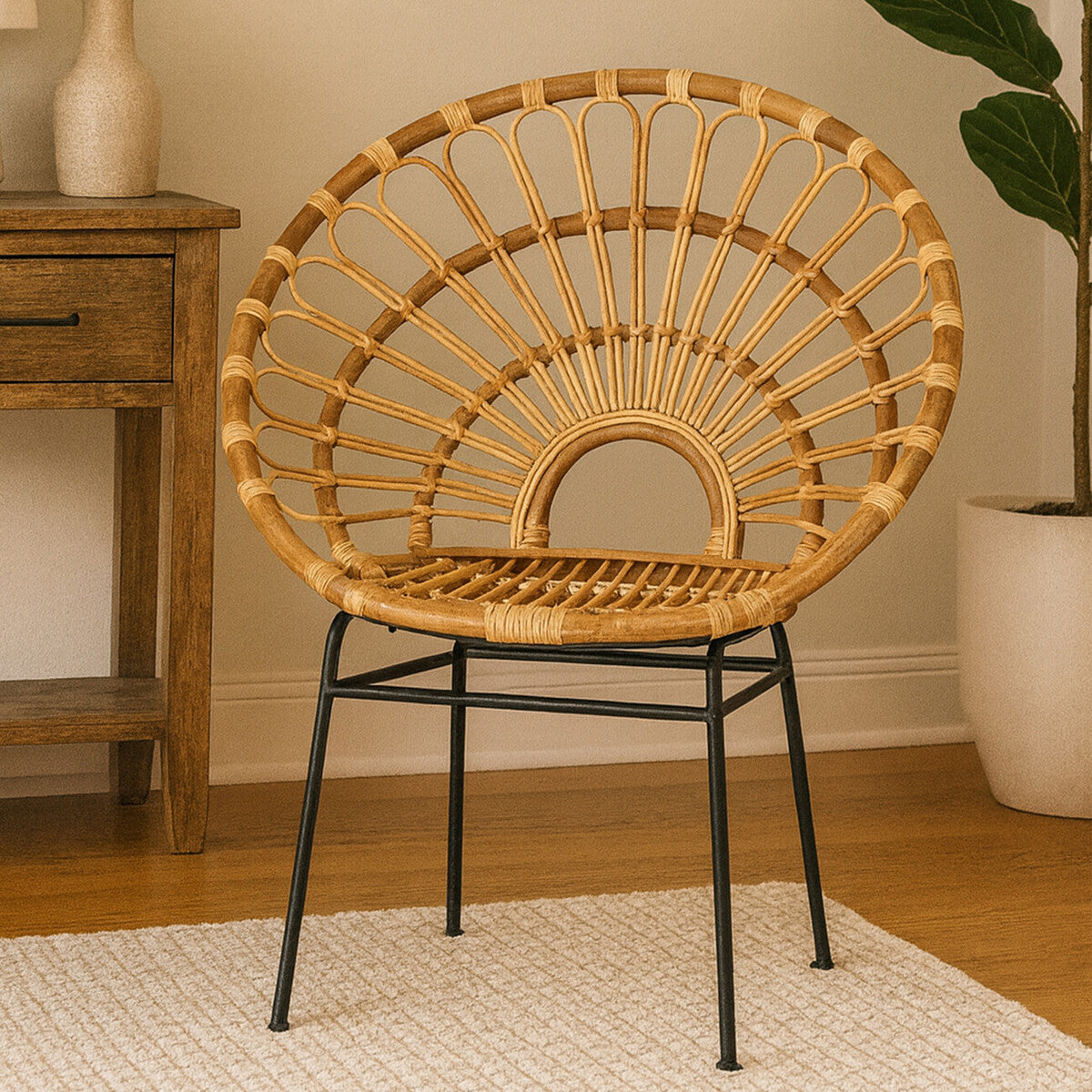 Natural rattan chair with a sunflower-shaped backrest, featuring a round seat and black metal legs, placed on a light-colored rug in a cozy interior setting with a plant and wooden furniture in the background