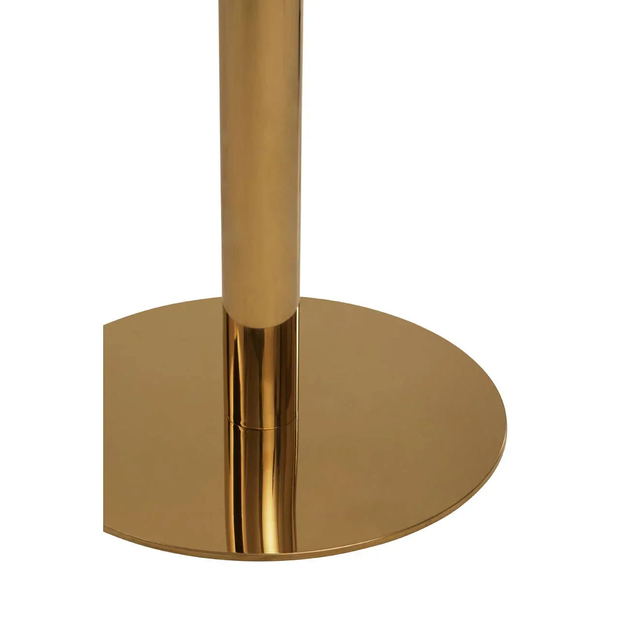 Close up of gold metal table base with round pedestal design