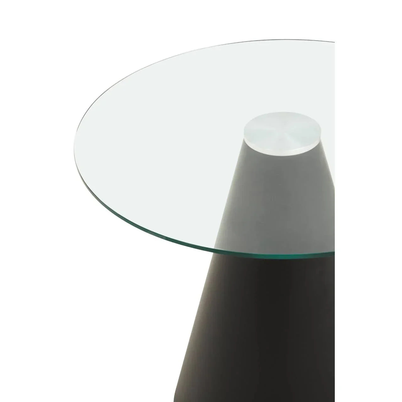 Round glass side table with black conical base, modern furniture close up