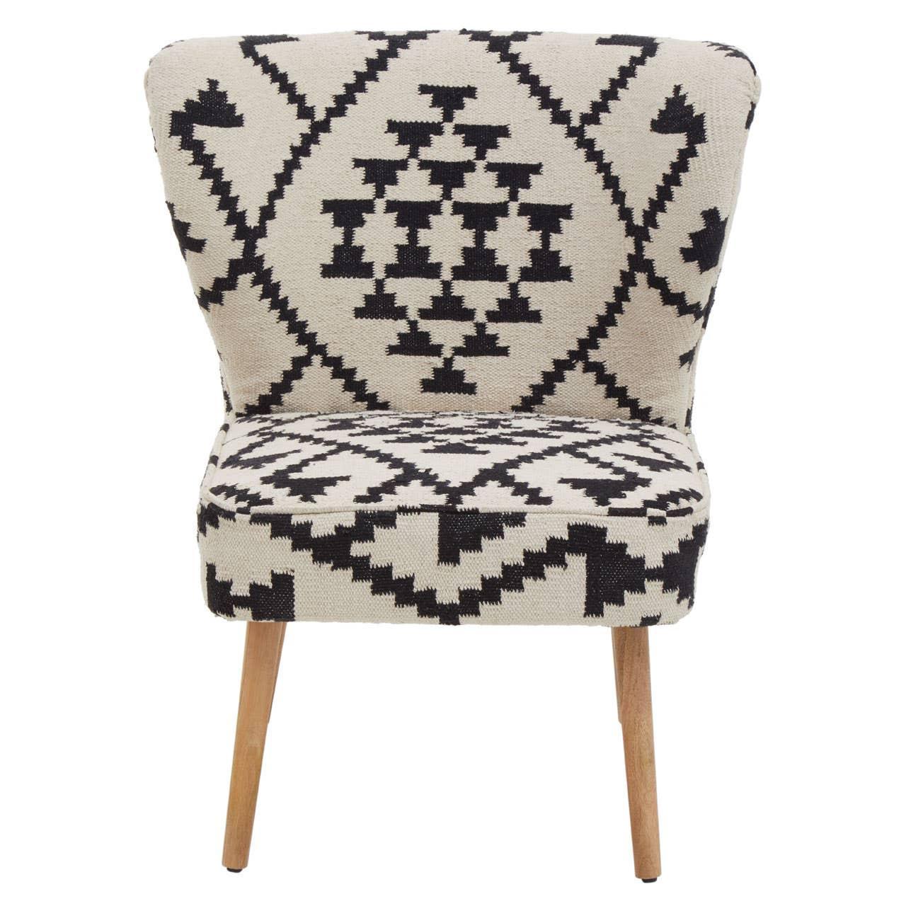 Accent chair with black and cream geometric upholstery and wooden legs, front view