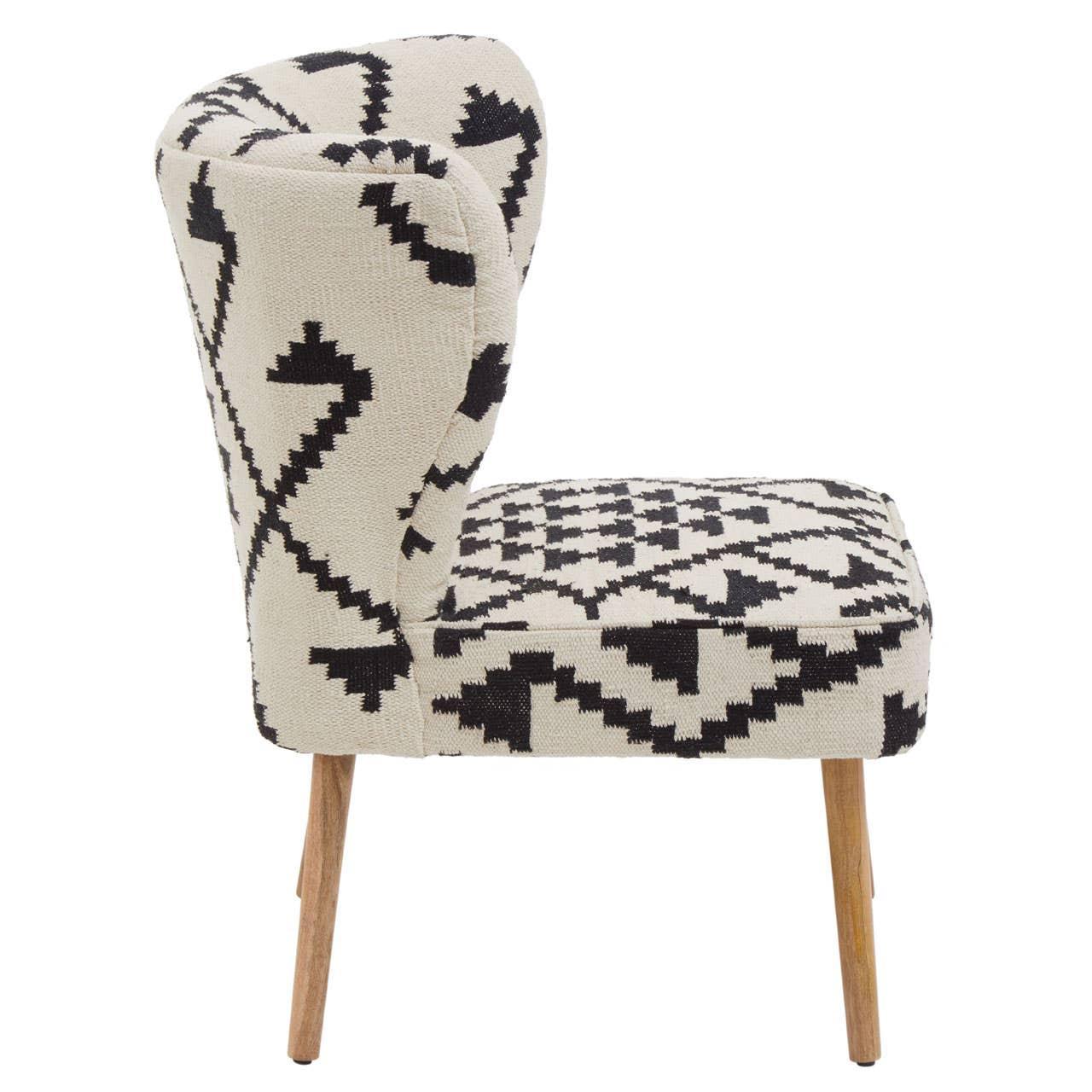Side view accent chair with black and white geometric upholstery and wooden legs