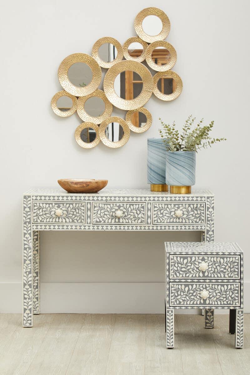 Bone inlay console table and matching bedside table with gold mirror wall decor