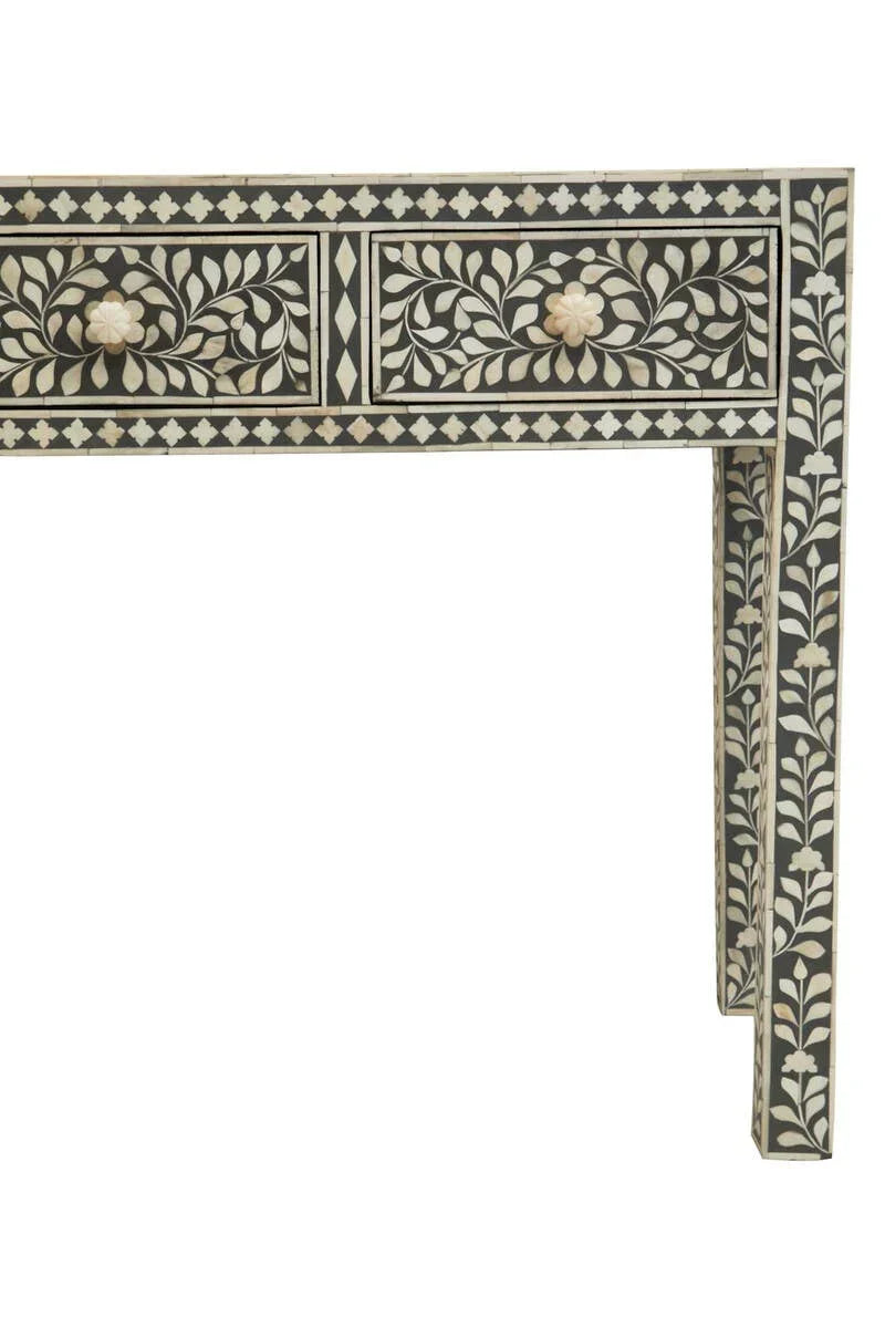 bone inlay console table with black and white floral pattern and two drawers front view