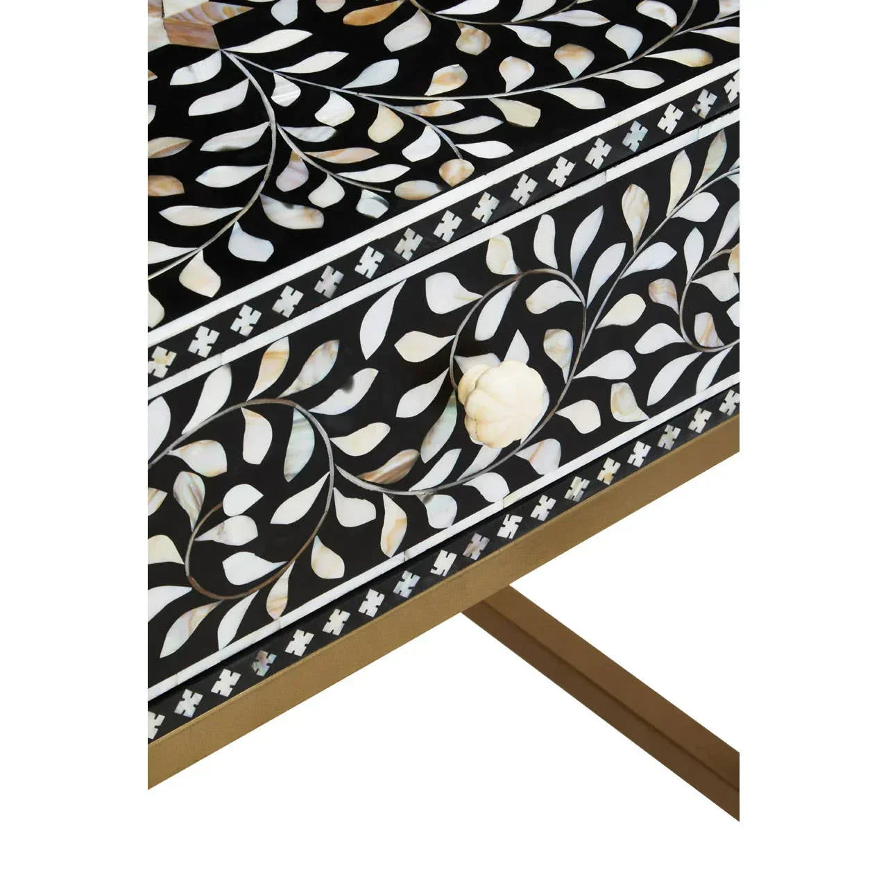 Black bone inlay furniture with intricate floral pattern and shell drawer handle close-up
