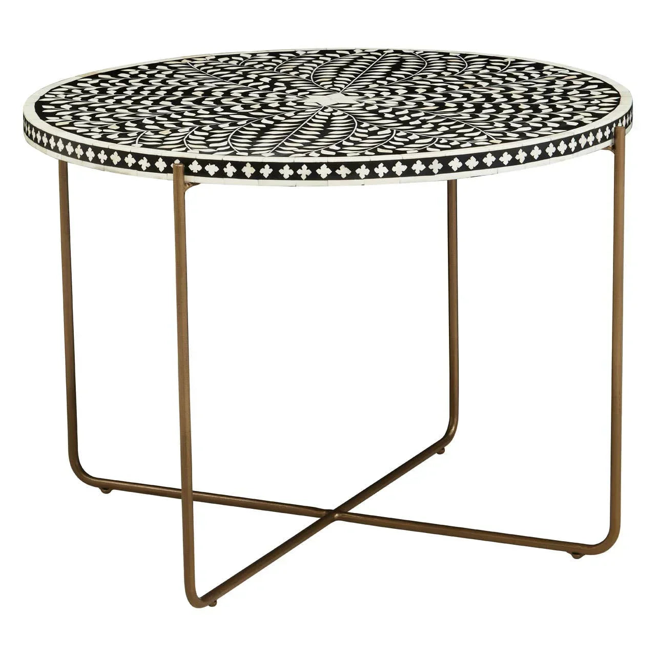 Round coffee table with black and white patterned top and slim gold metal legs