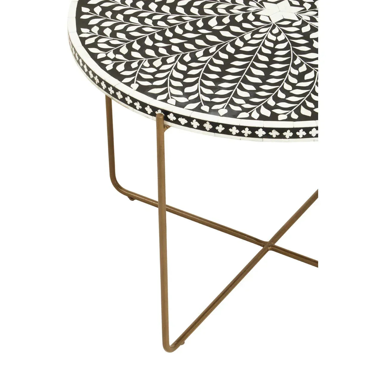 Round mosaic coffee table with black and white leaf pattern top and slim gold legs