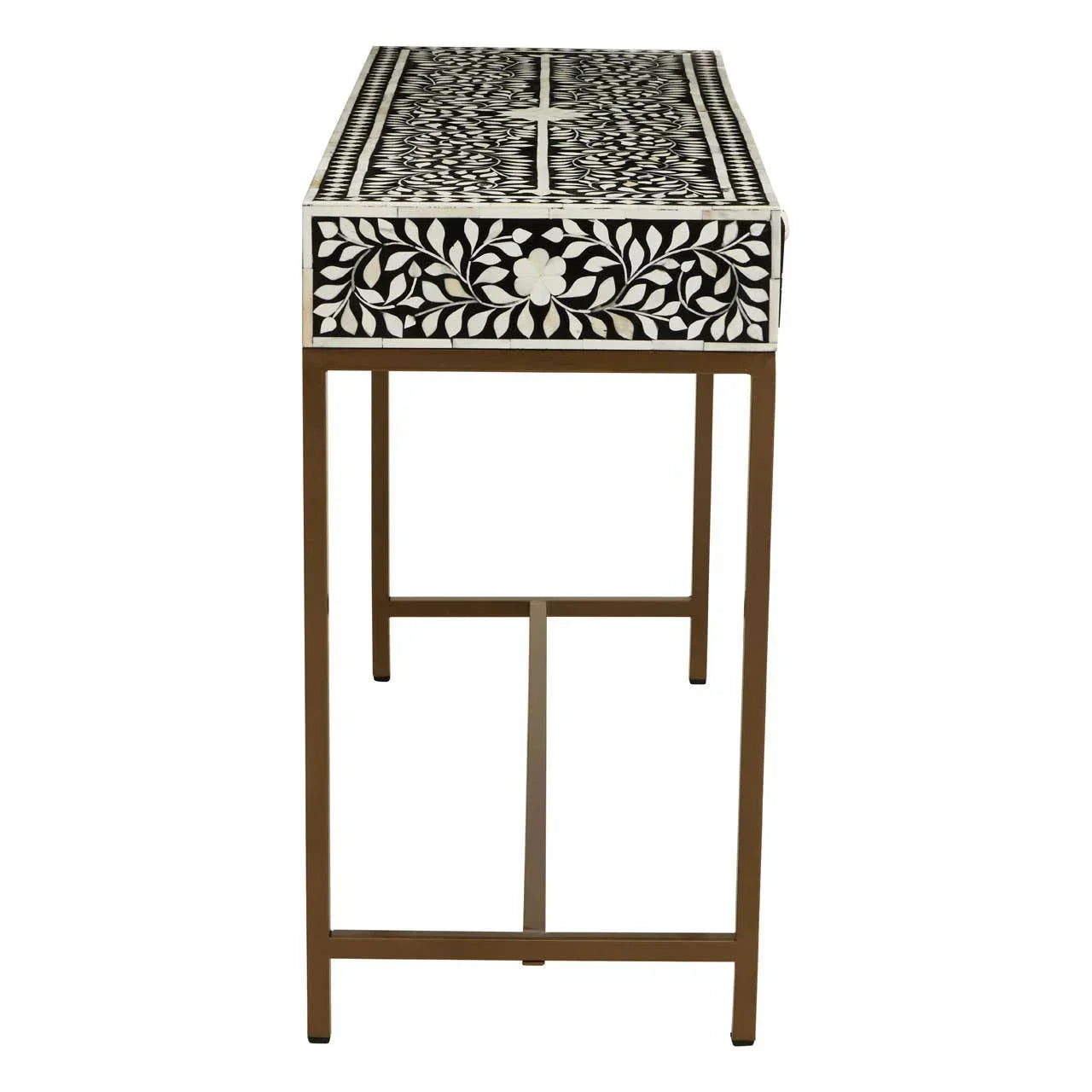 Bone inlay console table with floral black and white pattern, gold metal legs, side view
