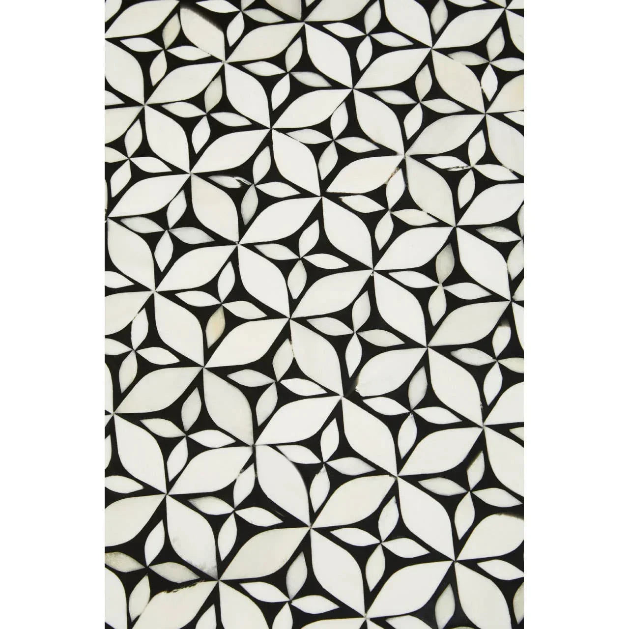 Black and white geometric patterned tile surface close-up