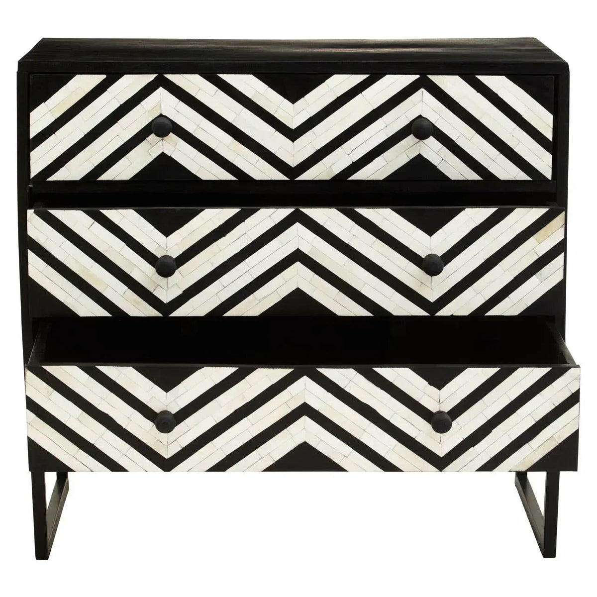 Black and white chevron chest of drawers with one drawer open on metal legs