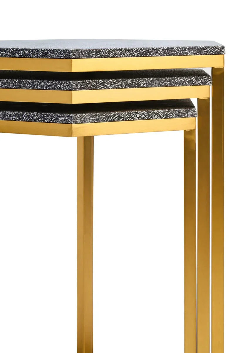 Set of three nesting tables with gold metal frames and textured black tops