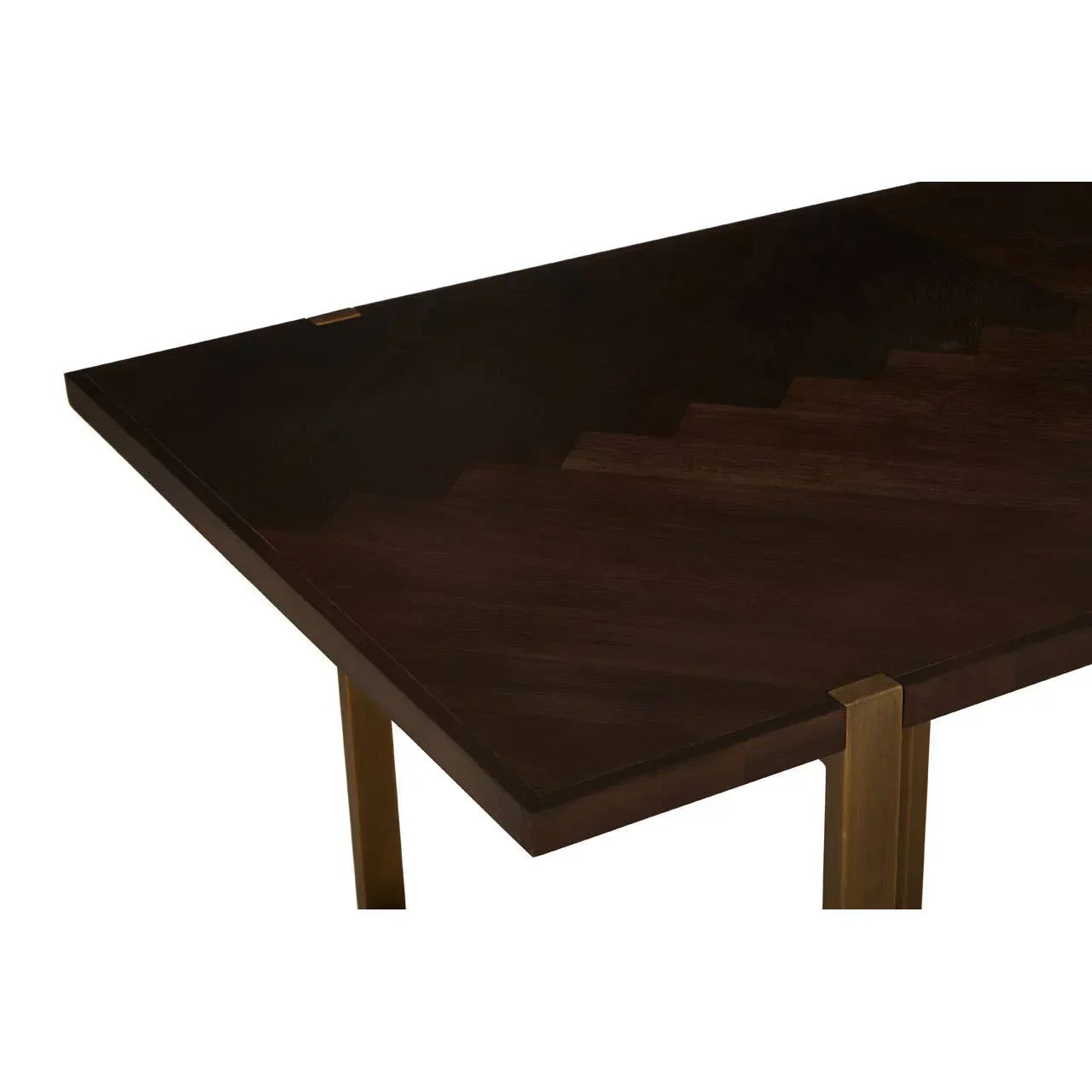 Dark wood dining table with gold metal legs, close corner view