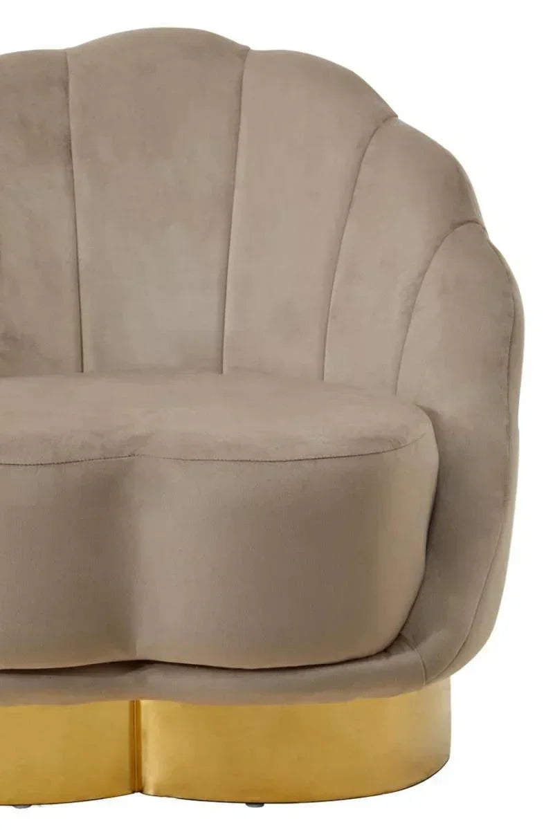 Beige velvet accent chair with scalloped backrest and gold metal base, front close-up view
