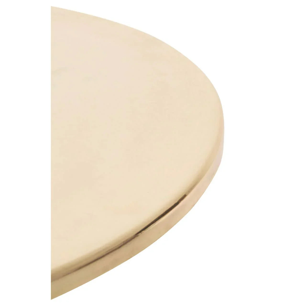 Closeup of round gold metal table top with smooth polished finish