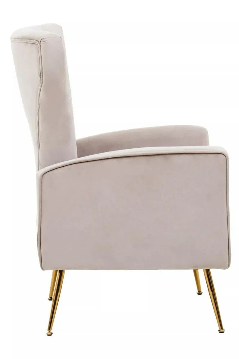 Velvet accent chair side view with gold metal legs and high backrest