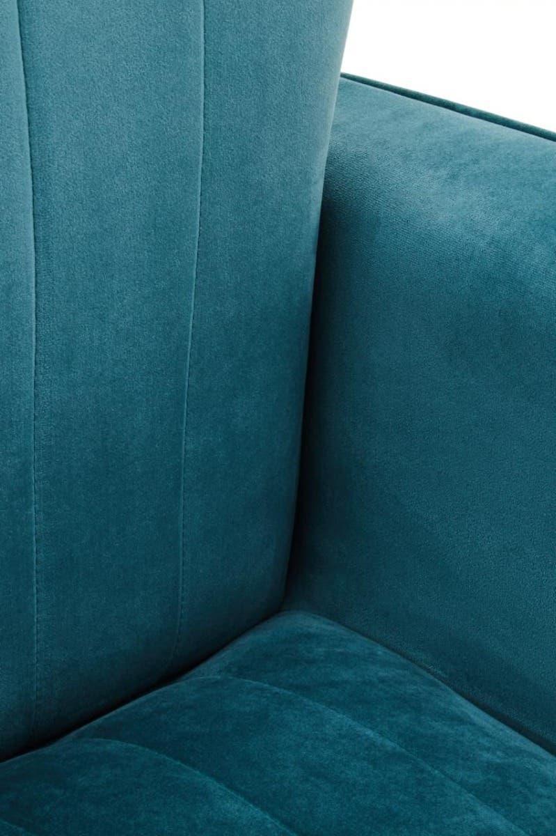 Close-up of teal velvet armchair seat and backrest with vertical stitching detail