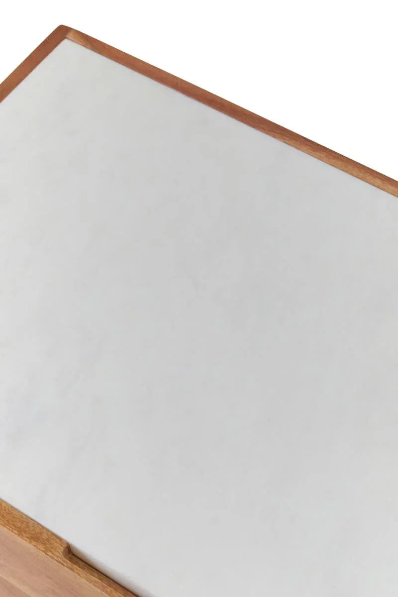 White marble tabletop with wooden edge, close-up showing corner detail