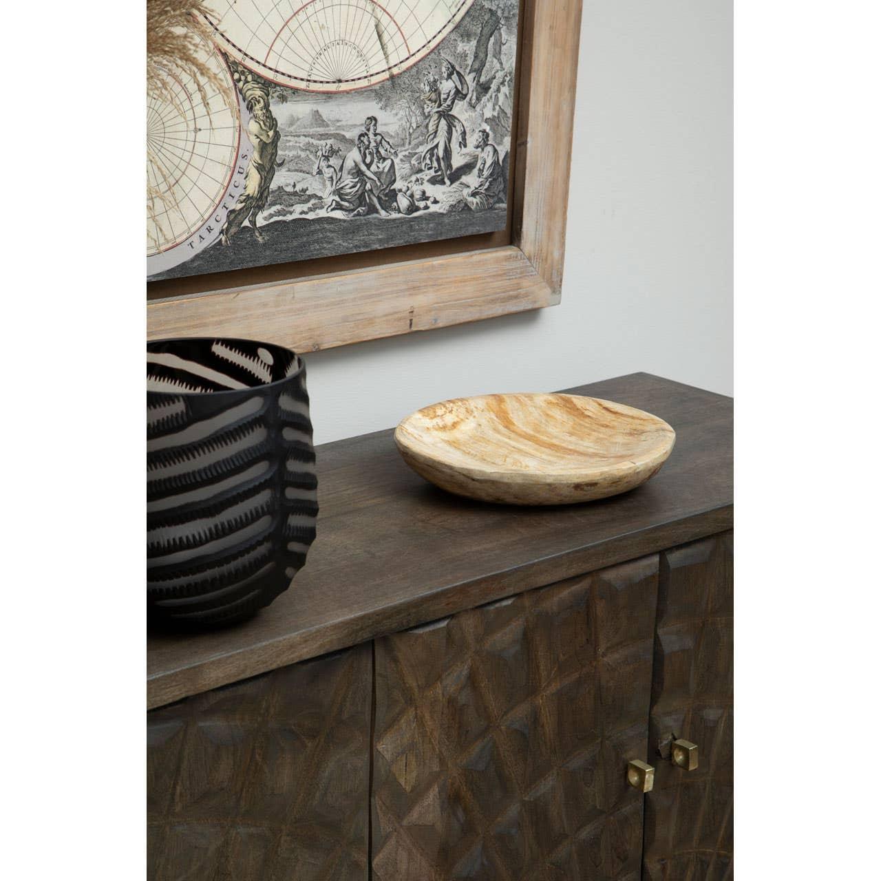 Dark wood sideboard with geometric doors, decorative bowl, and black vase on top