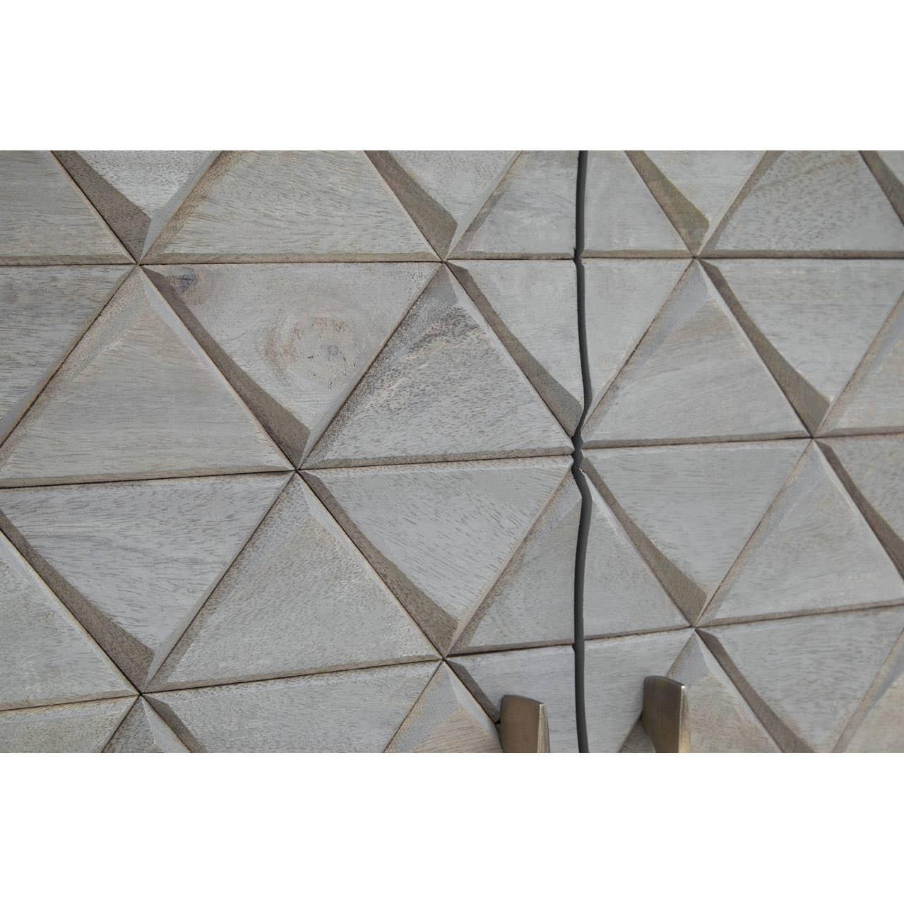Textured wood cabinet doors with geometric carved panels and metal handles