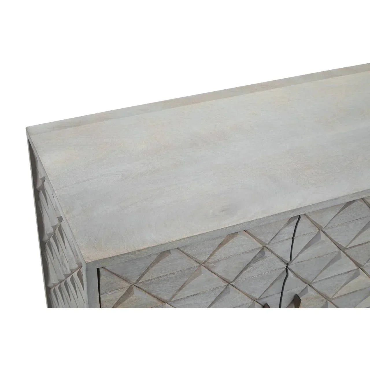 Light wood sideboard with geometric carved front and smooth top, corner angled view