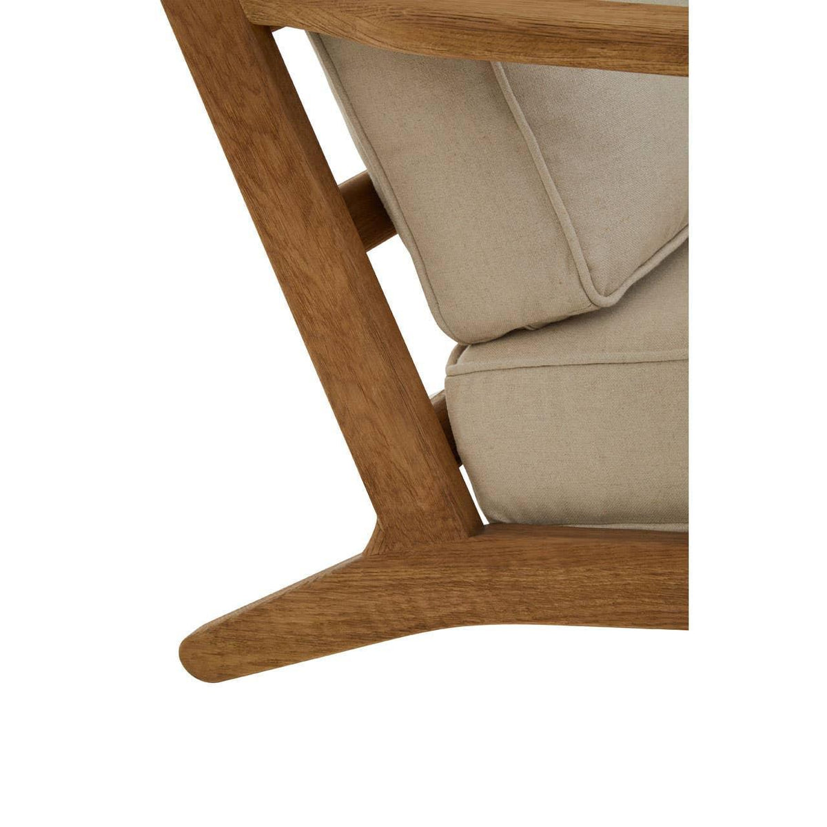 Closeup of wooden armchair frame with beige fabric cushions