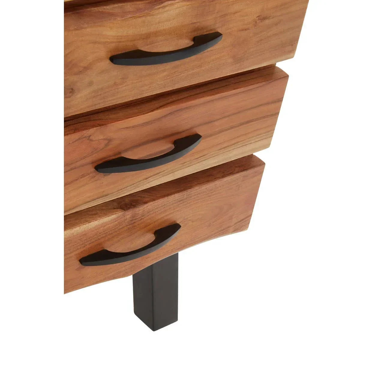 Close-up of wooden chest of drawers with black metal handles and leg